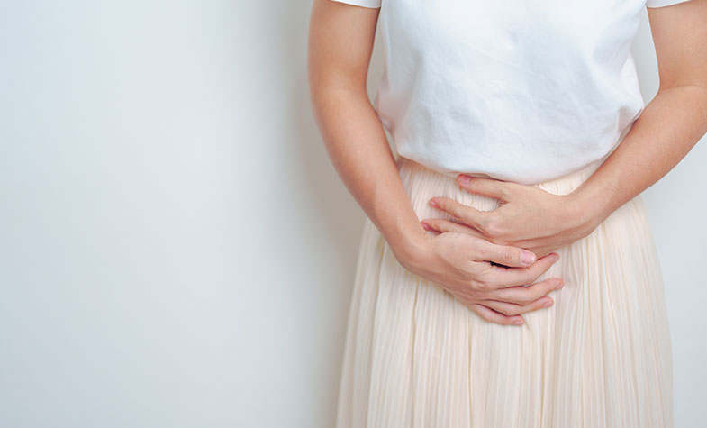 Person with hands on their pelvis