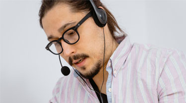 Man talking, wearing phone headset