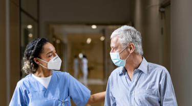 Female doctor with older male patient