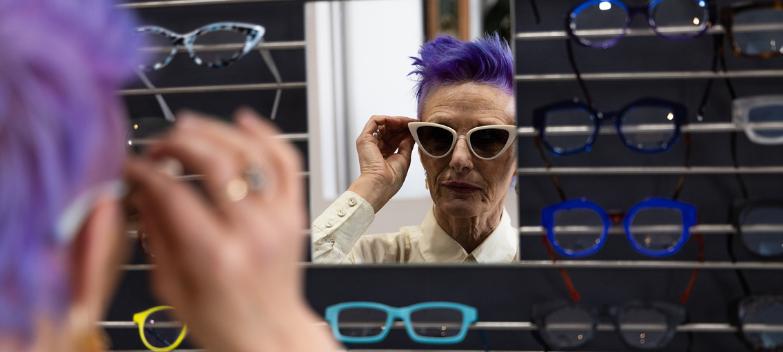 Photo of person trying on glasses