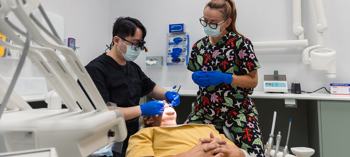 Photo of a dental practitioner with a patient