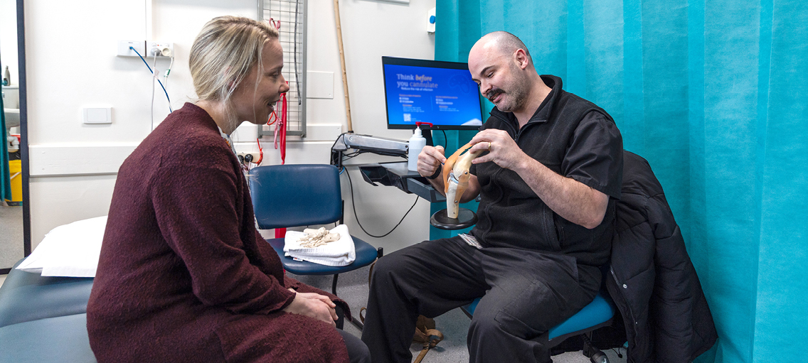 Photo of a practitioner with a  patient