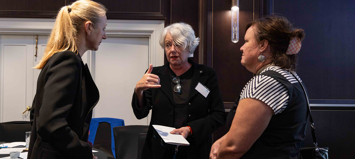 Photo of Ahpra staff in discussion