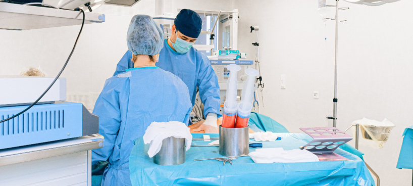 Photo of 2 medical practioners in an operation theater